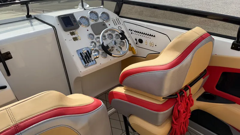  Yacht Photos Pics 2007 Fountain 42 Lightning boat interior with steering wheel and gauges.