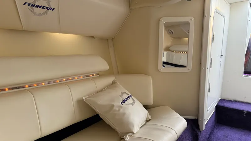  Yacht Photos Pics Interior of 2007 Fountain 42 Lightning boat with cream seating and mirror.