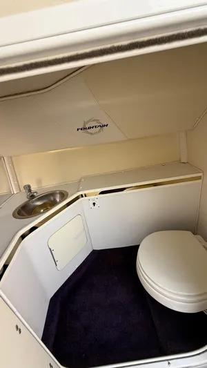  Yacht Photos Pics 2007 Fountain 42 Lightning boat bathroom with sink and toilet.