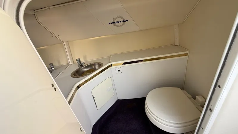  Yacht Photos Pics 2007 Fountain 42 Lightning boat bathroom with sink and toilet.