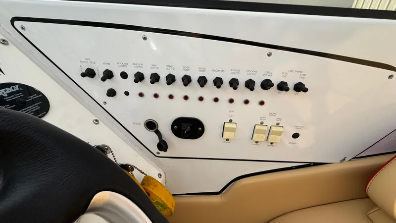  Yacht Photos Pics Control panel of a 2007 Fountain 42 Lightning boat with switches and knobs.