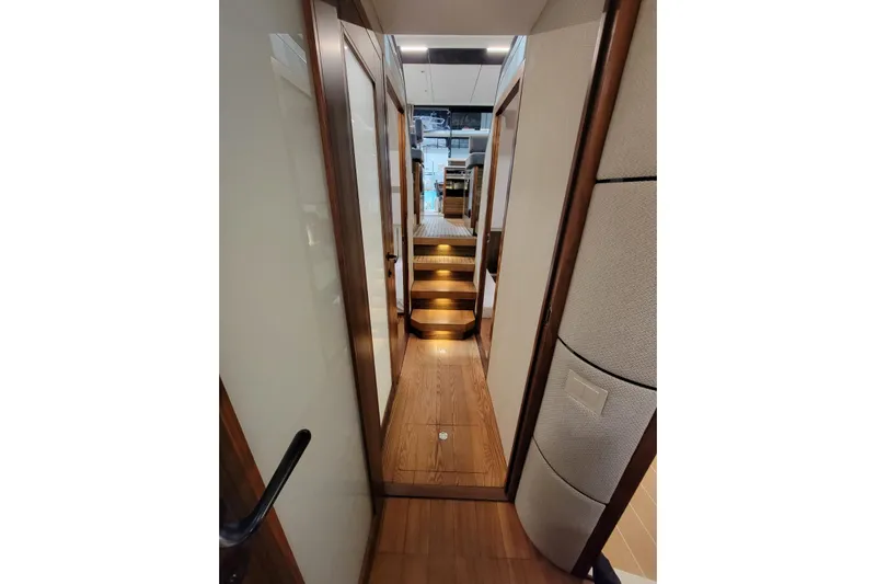 Soul Yacht Photos Pics Interior hallway of 2025 Marex 440 Gourmet Cruiser with wooden flooring and modern design.