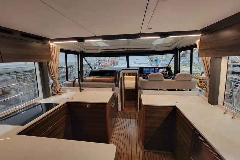 Soul Yacht Photos Pics Luxurious interior of 2025 Marex 440 Gourmet Cruiser yacht with modern kitchen and helm.