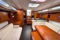 Luxurious interior of 2009 Dufour 45E Performance yacht with wood finish and modern amenities.