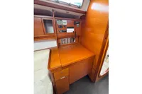 2009 Dufour 45E Performance yacht interior with wooden navigation station.