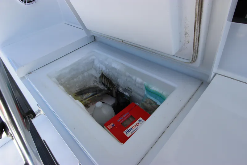  Yacht Photos Pics Built-in cooler on 2004 Hatteras 60 Convertible yacht, storing various items.