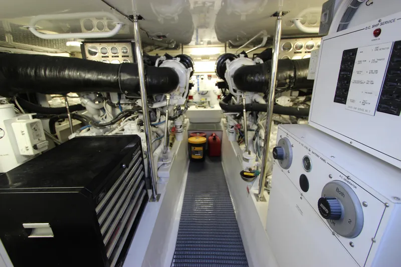  Yacht Photos Pics Engine room of 2004 Hatteras 60 Convertible yacht, featuring dual engines and control panels.