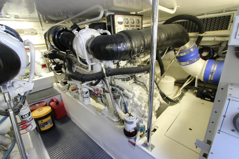  Yacht Photos Pics Engine room of 2004 Hatteras 60 Convertible yacht, showcasing machinery and components.