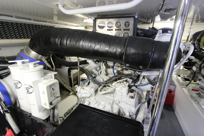  Yacht Photos Pics Engine room of 2004 Hatteras 60 Convertible yacht, showcasing machinery and control panels.