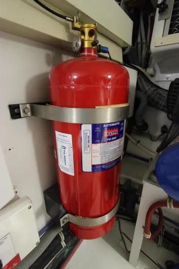  Yacht Photos Pics Red fire extinguisher in 2004 Hatteras 60 Convertible engine room.