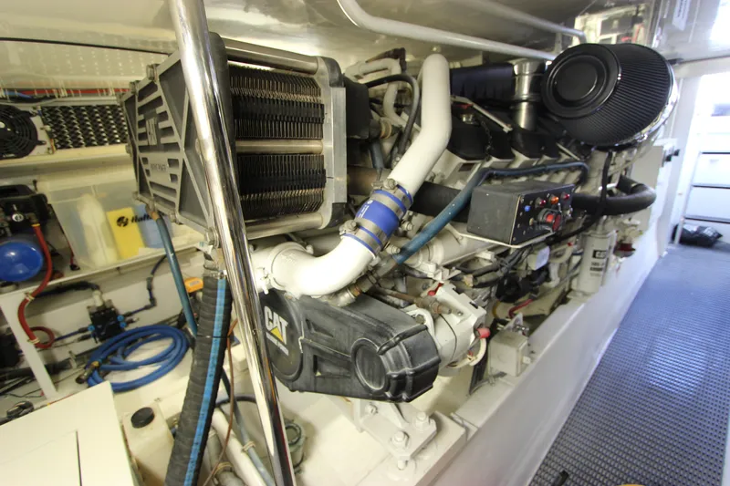  Yacht Photos Pics Engine room of 2004 Hatteras 60 Convertible yacht, featuring CAT machinery and components.