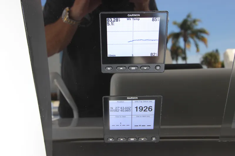  Yacht Photos Pics Garmin displays on a 2004 Hatteras 60 Convertible yacht, showing navigation and temperature data.