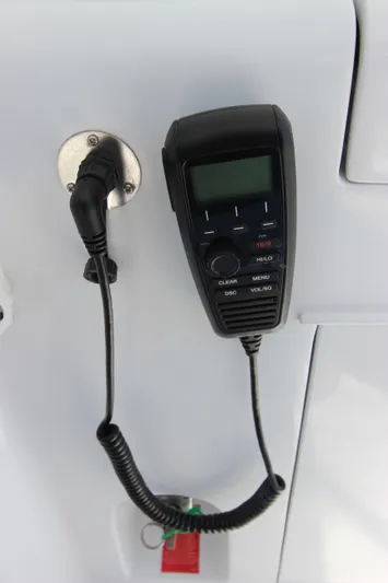  Yacht Photos Pics Marine radio handset on a 2004 Hatteras 60 Convertible yacht.