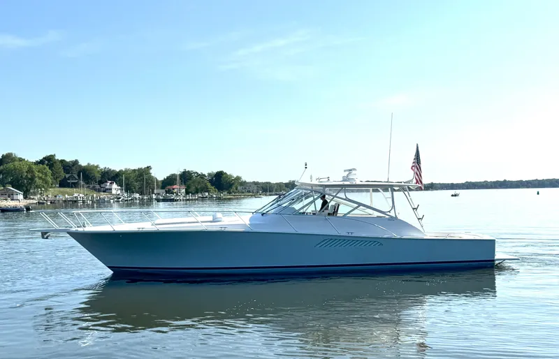 Peace Out Yacht Photos Pics 2007 Viking 52 Open yacht on calm water with clear sky.