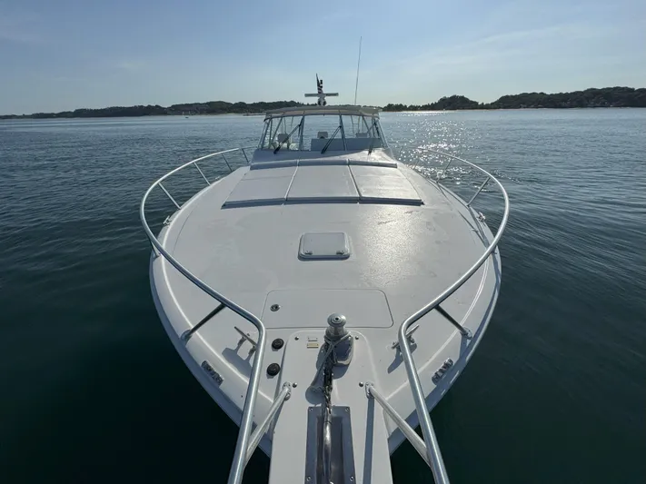 Peace Out Yacht Photos Pics 2007 Viking 52 Open yacht on calm water, showcasing sleek deck design.