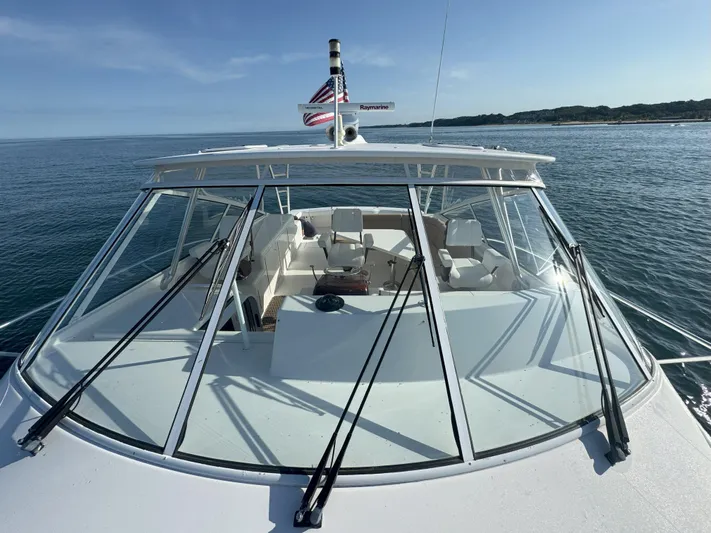 Peace Out Yacht Photos Pics 2007 Viking 52 Open yacht on calm sea, showcasing sleek design and spacious deck.