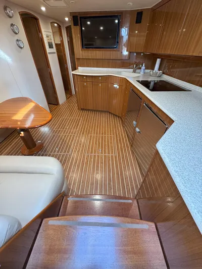 Peace Out Yacht Photos Pics Luxurious interior of a 2007 Viking 52 Open yacht with wood finishes and modern amenities.