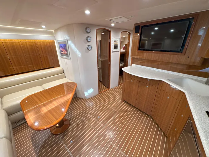 Peace Out Yacht Photos Pics Luxurious interior of 2007 Viking 52 Open yacht with wood finishes and modern amenities.
