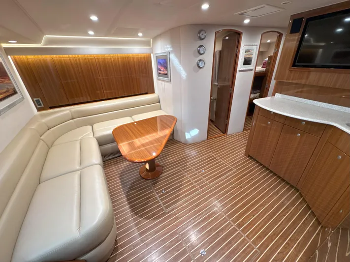 Peace Out Yacht Photos Pics Luxurious interior of 2007 Viking 52 Open yacht with leather seating and wooden accents.