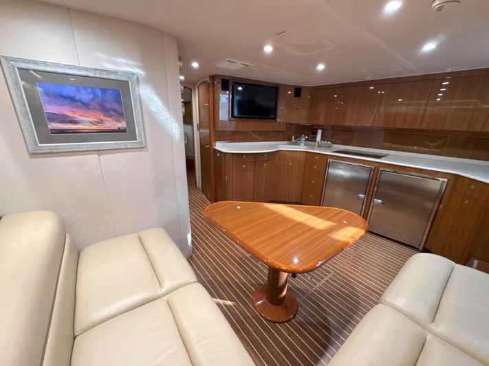 Peace Out Yacht Photos Pics Luxurious interior of 2007 Viking 52 Open yacht with elegant wood finishes and modern amenities.