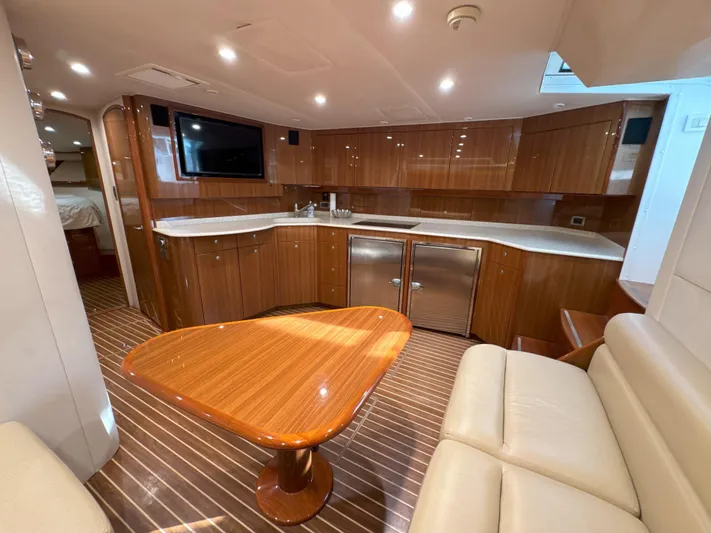 Peace Out Yacht Photos Pics Luxurious interior of a 2007 Viking 52 Open yacht with wood finishes and modern amenities.