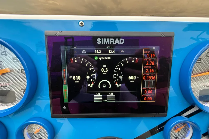  Yacht Photos Pics Simrad display on 2021 Velocity 290sc boat dashboard showing RPM and system status.