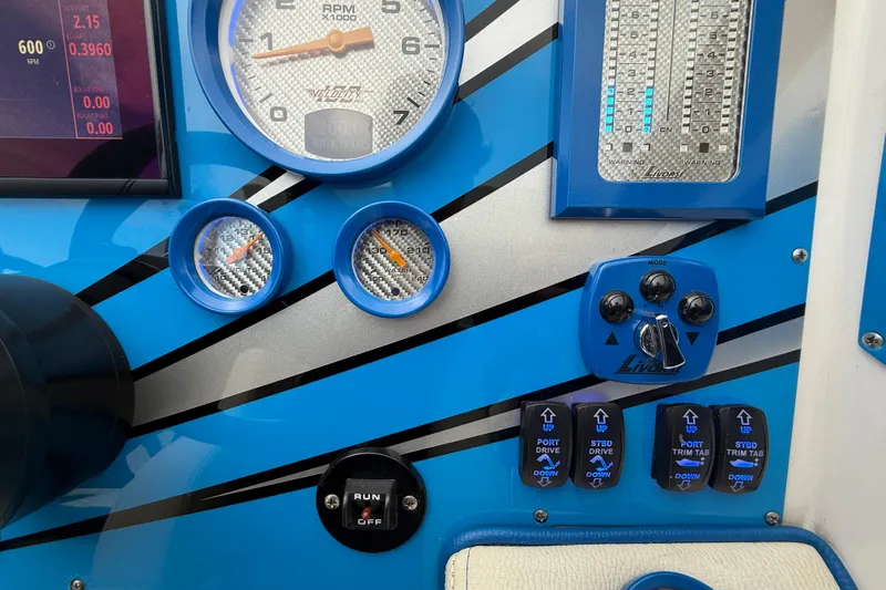  Yacht Photos Pics Control panel of a 2021 Velocity 290sc boat with gauges and switches.