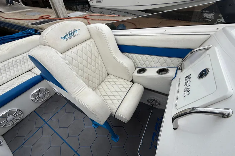 Yacht Photos Pics Luxury interior of 2021 Velocity 290sc boat with white and blue seating.