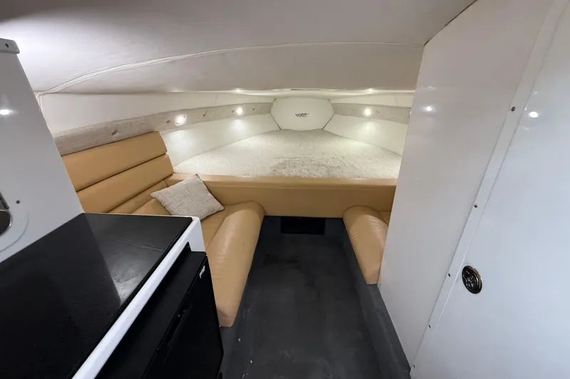  Yacht Photos Pics Interior of 2021 Velocity 290sc boat with cozy seating and sleeping area.