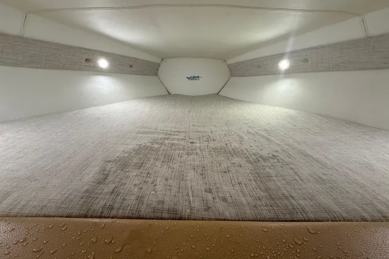  Yacht Photos Pics Interior cabin of 2021 Velocity 290sc boat with lighting and fabric details.