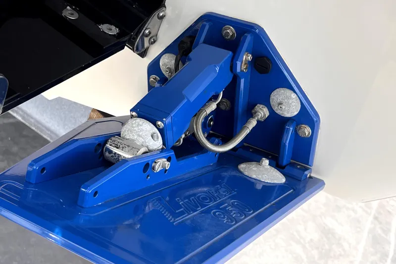  Yacht Photos Pics 2021 Velocity 290sc boat trim tab mechanism in blue, showcasing hydraulic components.