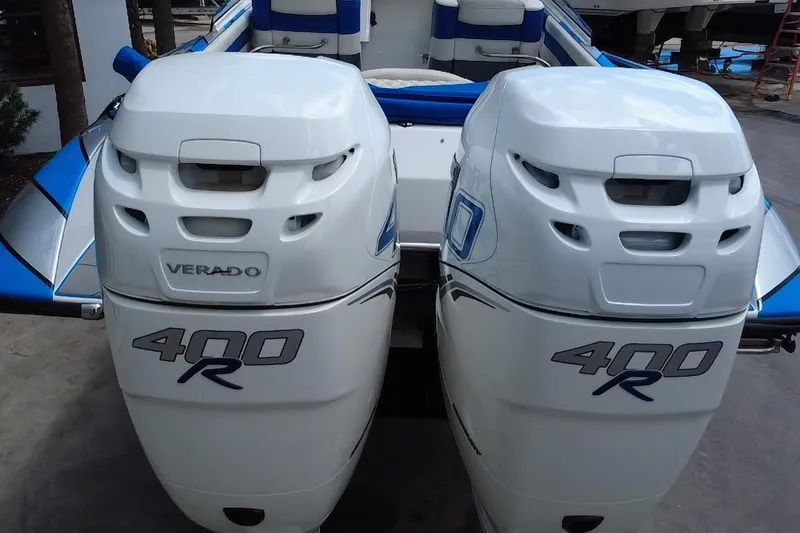  Yacht Photos Pics Twin Verado 400R engines on a 2021 Velocity 290sc boat, featuring blue and white seating.