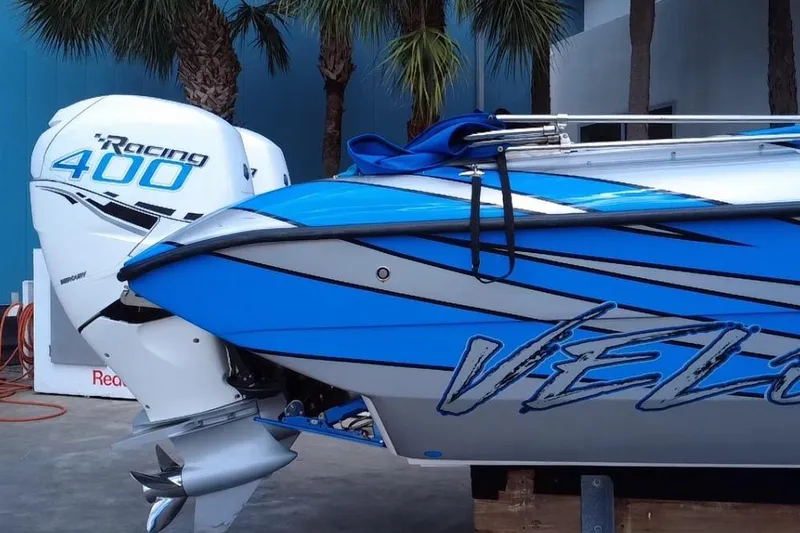  Yacht Photos Pics 2021 Velocity 290sc boat with Racing 400 engine, blue and white design.