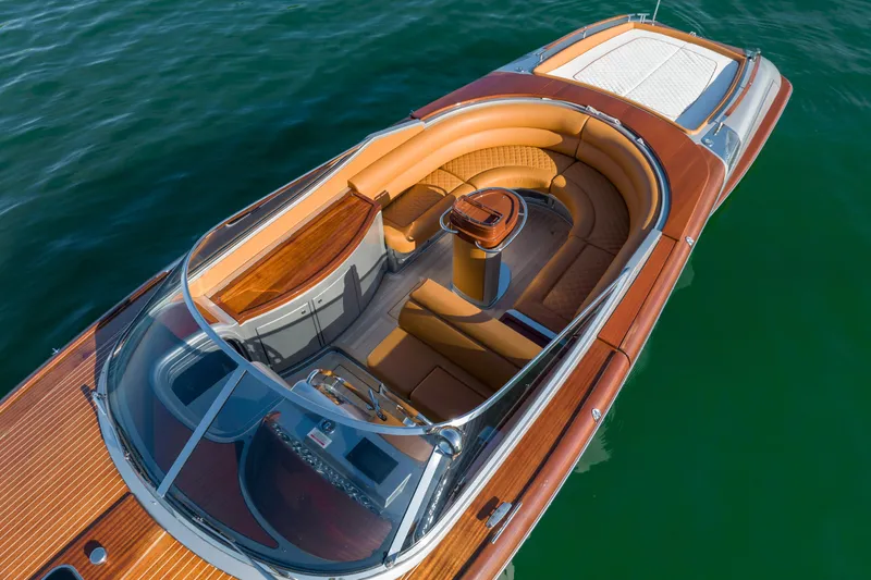 Mia Mia Yacht Photos Pics 2020 Riva Aquariva Super luxury speedboat with elegant wooden deck and leather seating.