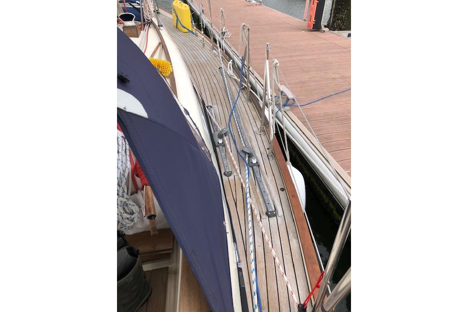 Deck of a 1995 Rival 36 sailboat docked at a marina.