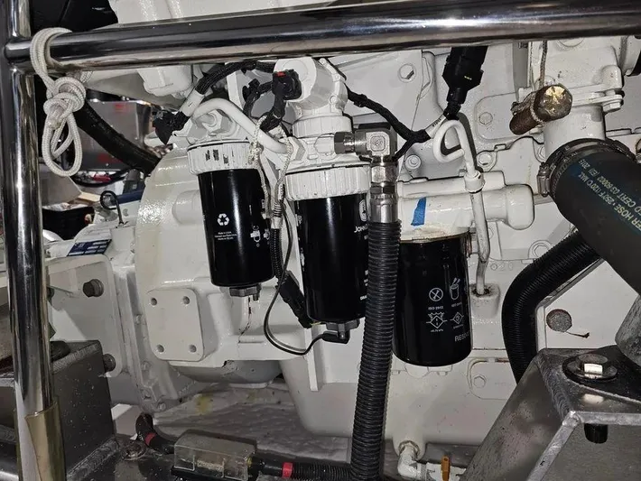 Carmella Yacht Photos Pics Engine components of a 2019 Kadey-Krogen 44AE yacht, featuring filters and hoses.