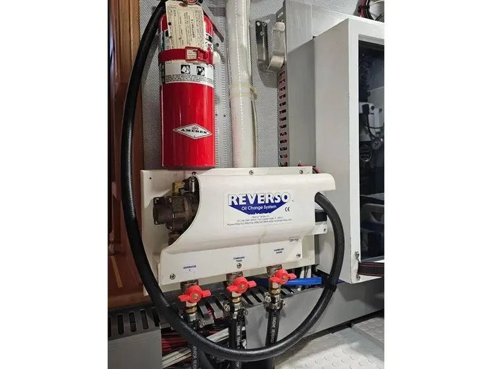 Carmella Yacht Photos Pics Engine room of 2019 Kadey-Krogen 44AE with Reverso oil change system and fire extinguisher.