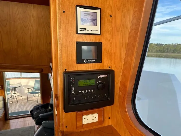 Carmella Yacht Photos Pics Control panel inside 2019 Kadey-Krogen 44AE yacht, featuring navigation and electrical systems.