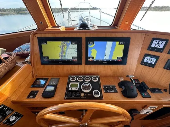 Carmella Yacht Photos Pics Pilothouse of 2019 Kadey-Krogen 44AE yacht with navigation screens and controls.
