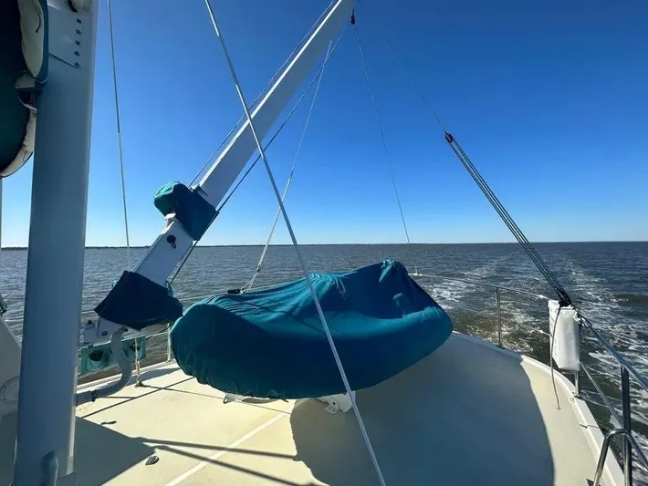 Carmella Yacht Photos Pics Kadey-Krogen 44AE 2019 yacht deck with blue cover, ocean view, clear sky.