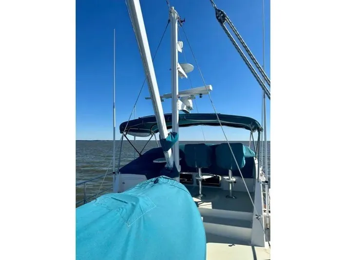 Carmella Yacht Photos Pics 2019 Kadey-Krogen 44AE yacht with blue covers, sailing on open water under clear skies.