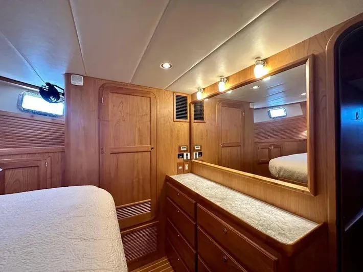 Carmella Yacht Photos Pics Luxurious wood-finished cabin interior of 2019 Kadey-Krogen 44AE yacht with ample storage.