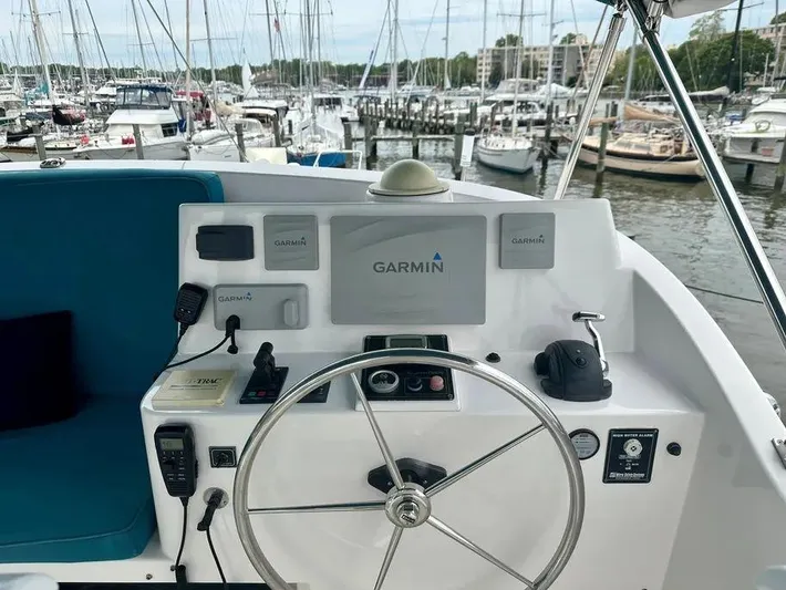 Carmella Yacht Photos Pics Helm of 2019 Kadey-Krogen 44AE yacht with Garmin navigation, docked at marina.