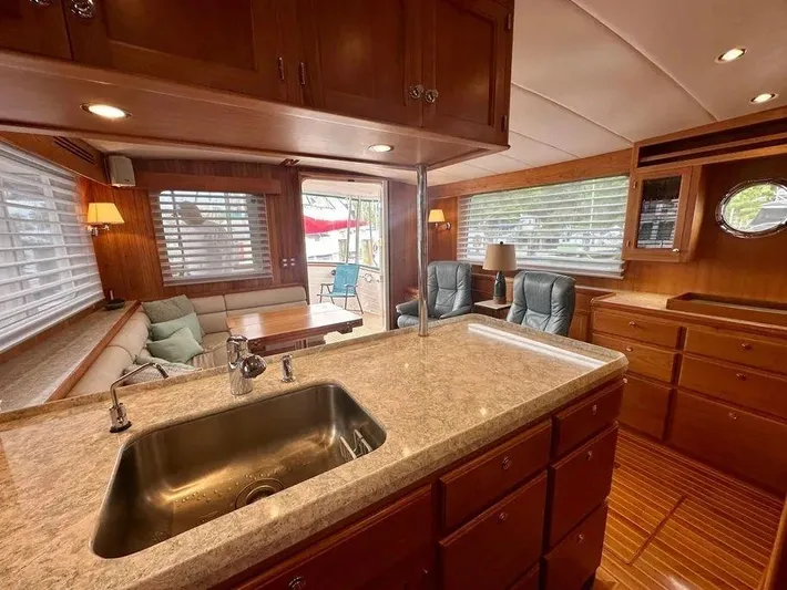 Carmella Yacht Photos Pics Luxurious interior of 2019 Kadey-Krogen 44AE yacht with spacious seating and modern kitchen.
