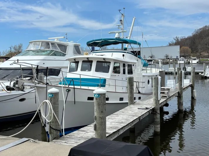 Carmella Yacht Photos Pics Kadey-Krogen 44AE 2019 yacht docked at marina, clear sky, calm water.
