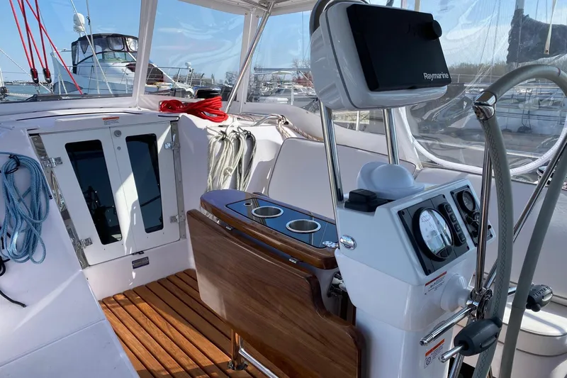 Sea Fever IV Yacht Photos Pics 2022 Catalina 355 yacht cockpit with navigation equipment and teak flooring.