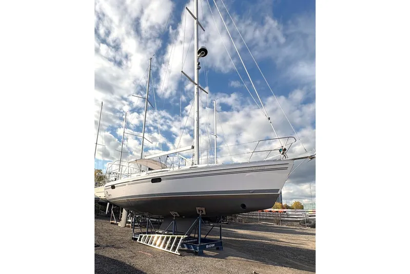 Sea Fever IV Yacht Photos Pics 2022 Catalina 355 sailboat on dry dock under a partly cloudy sky.