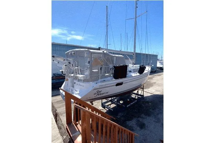 Sea Fever IV Yacht Photos Pics 2022 Catalina 355 sailboat on dry dock under clear blue sky.