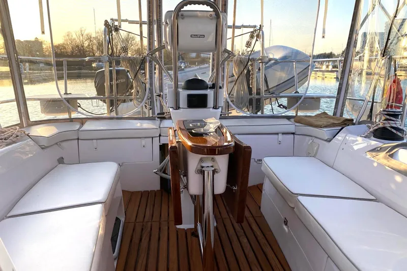 Sea Fever IV Yacht Photos Pics Interior view of a 2022 Catalina 355 sailboat with seating and navigation equipment.