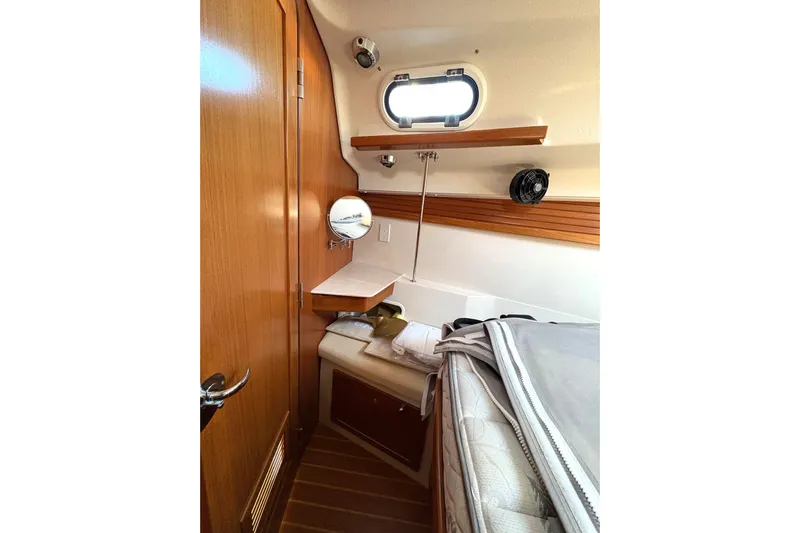 Sea Fever IV Yacht Photos Pics Interior of a 2022 Catalina 355 sailboat cabin with wooden accents and compact design.